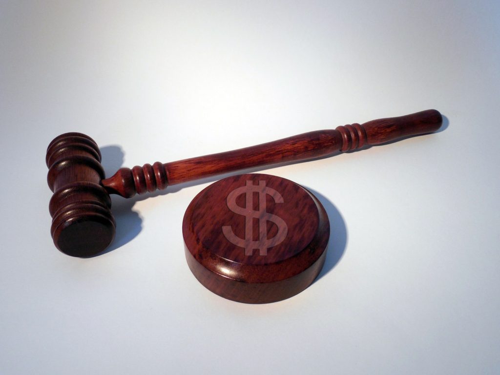 Gavel and dollar sign depicting lawsuit damages and case worth