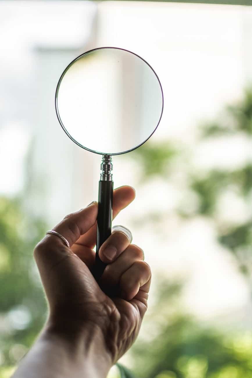 Magnifying glass with boca depicting legal discvoery